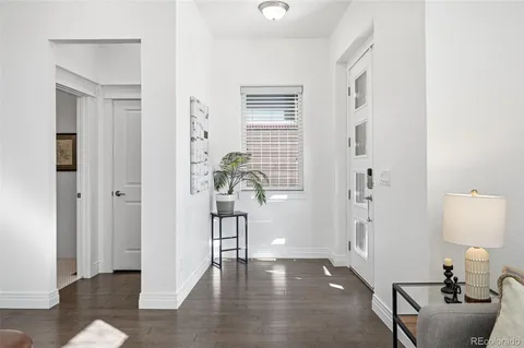 a view of entryway with livingroom and wooden floor