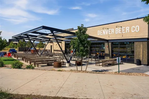 an outdoor living area with chairs and a table