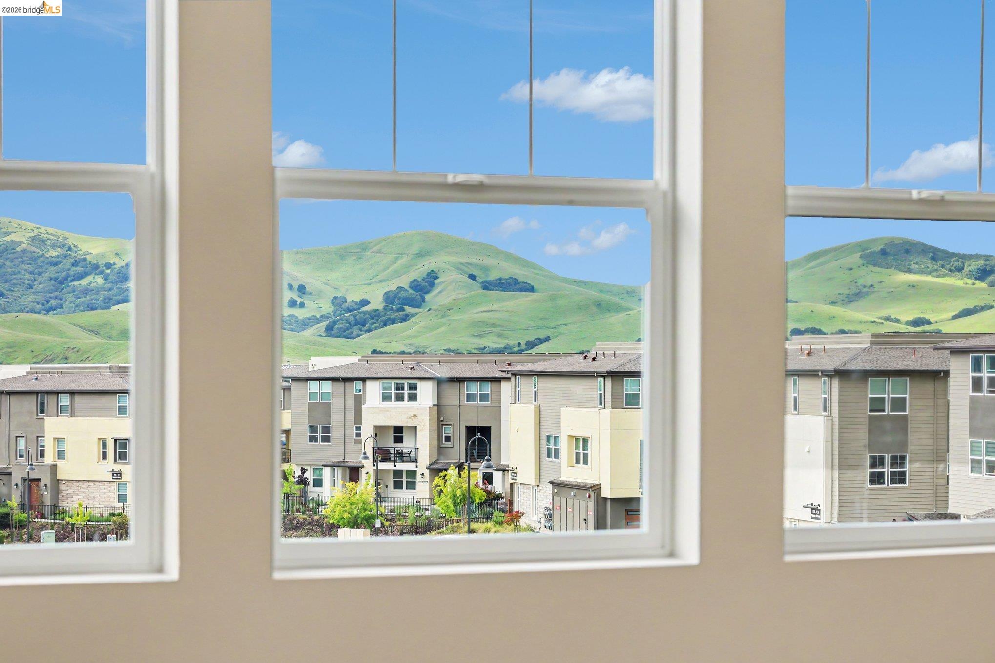 18210 Argento Loop San Ramon, CA 94583 - Photo 20 of 43 Multiple windows framing hillside and neighborhood architecture