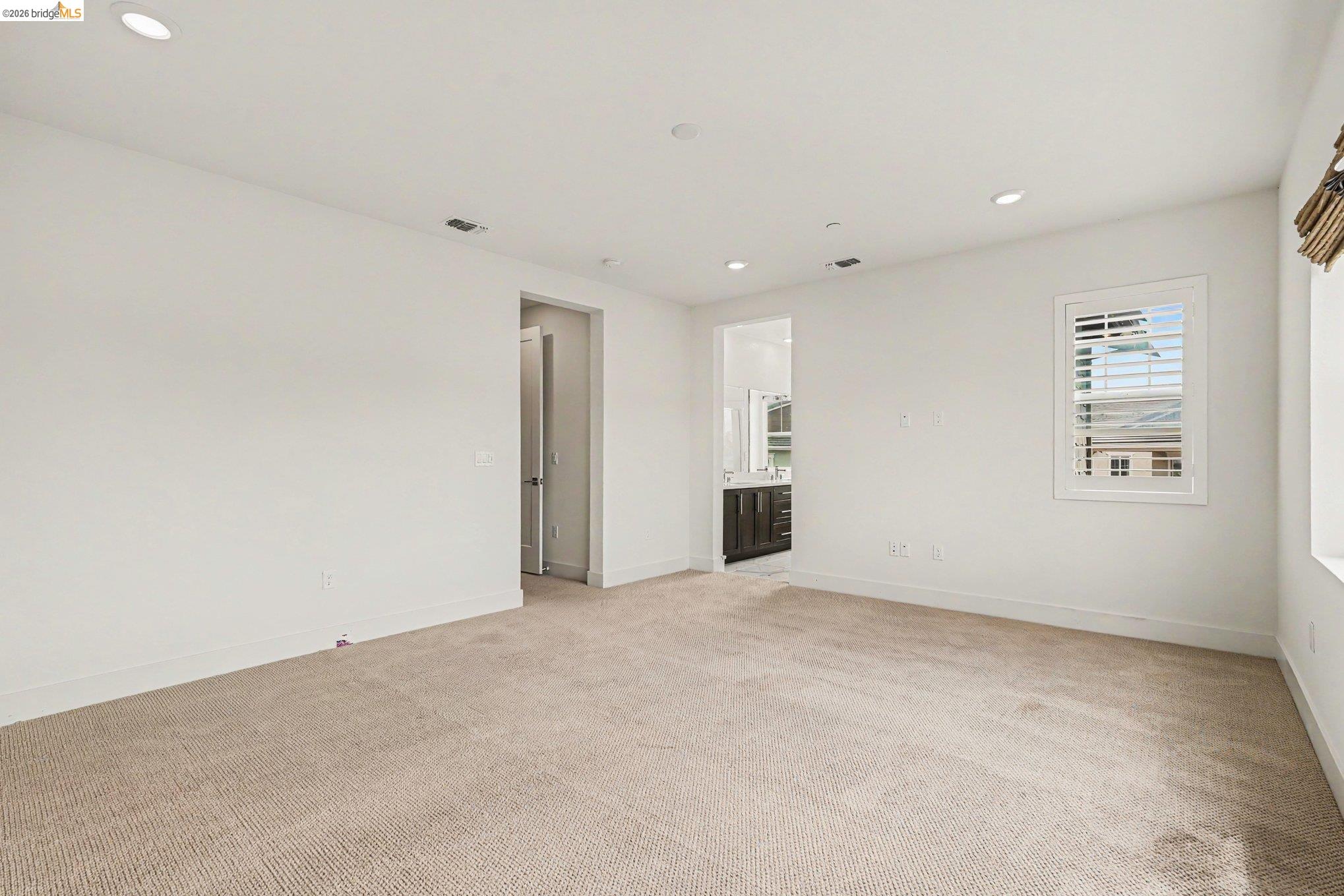 18210 Argento Loop San Ramon, CA 94583 - Photo 23 of 43 Spacious room featuring carpeted flooring, recessed lighting, and white walls