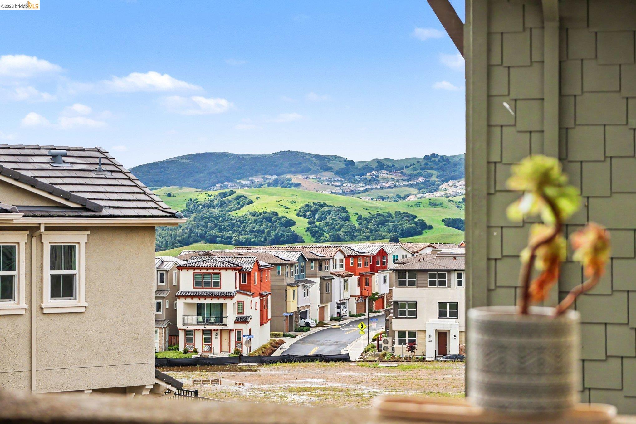 18210 Argento Loop San Ramon, CA 94583 - Photo 33 of 43 Rolling green hills and a bright blue sky provide a scenic backdrop to the neighborhood