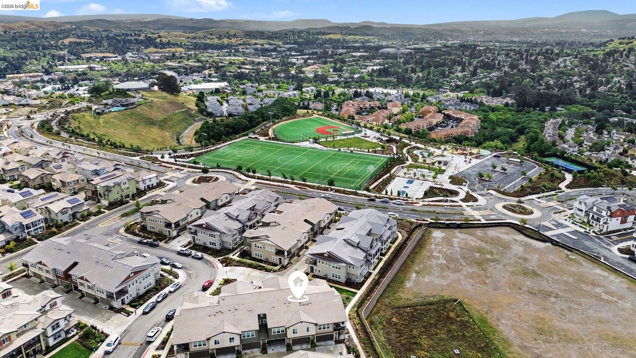 18210 Argento Loop San Ramon, CA 94583 - Photo 40 of 43 Modern townhome community featuring multi-story residences with attached garages and pitched roofs