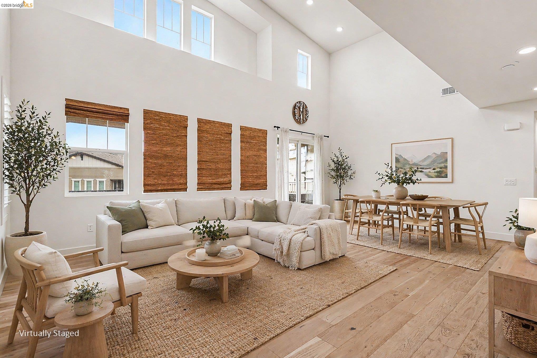 18210 Argento Loop San Ramon, CA 94583 - Photo 6 of 43 Vaulted ceilings with clerestory windows, wood-finish flooring, recessed lighting, and white walls