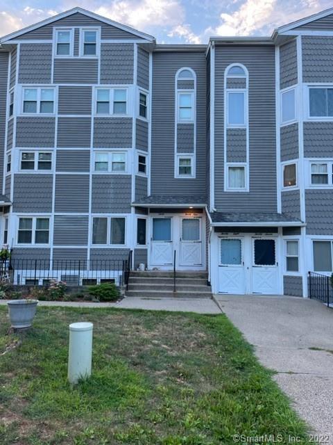 1655 North Colony Road, Unit 29 Meriden, CT 06450 - Photo 1 of 1 a front view of a house with a yard