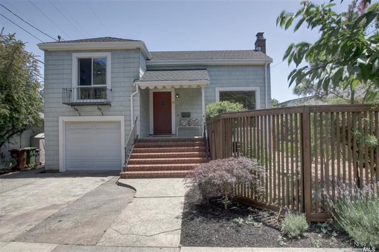 52 Butterfield Road San Anselmo, CA 94960 - Photo 1 of 1 a view of a house with a small yard and plants