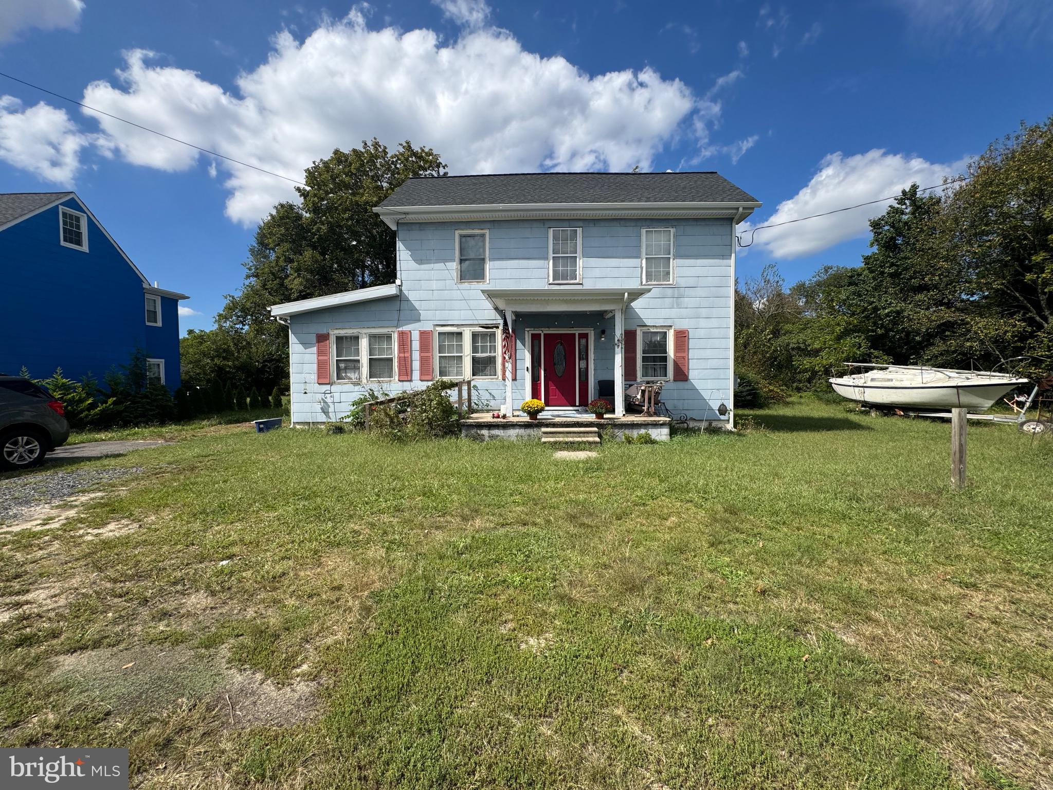 619 Main Street Leesburg, NJ 08327 - Photo 1 of 23 front view of a house with a yard