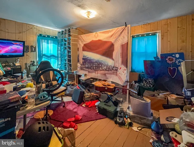 a room with lots of different colored cloths