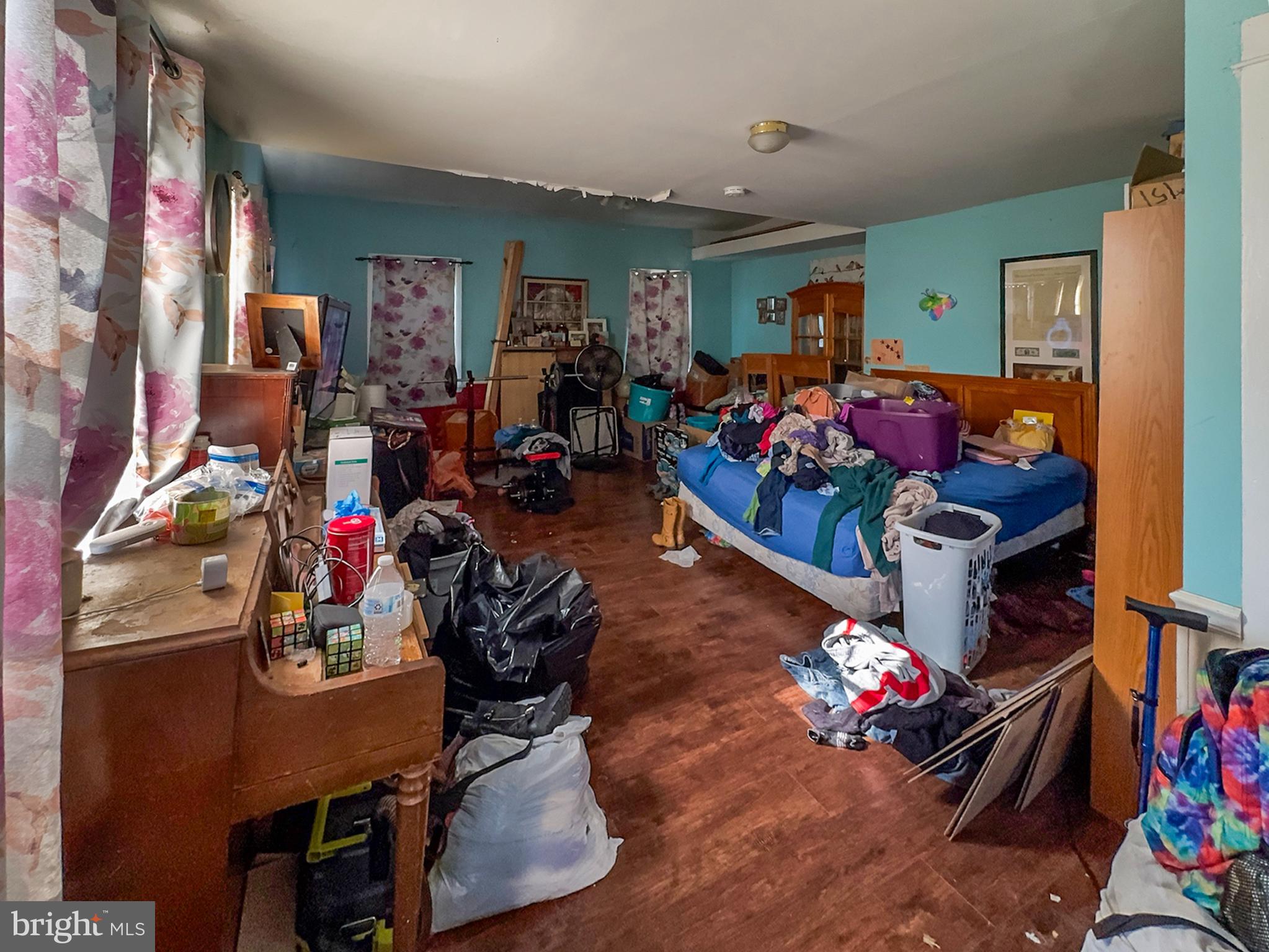 619 Main Street Leesburg, NJ 08327 - Photo 6 of 23 a room with lots of different colored cloths