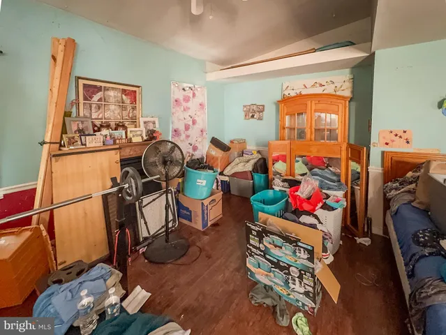 a living room filled with furniture and a flat screen tv