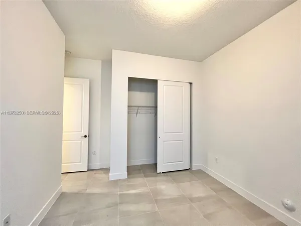 a bathroom with a sink and a washing machine