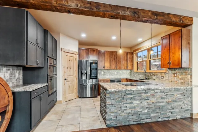 a kitchen with refrigerator cabinets and a counter top space