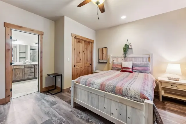 a bed room with a bed and a chandelier