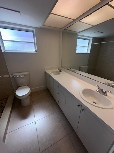 7500 Southwest 82nd Street, Unit G110 Miami, FL 33143 - Photo 9 of 13 a bathroom with a sink and a mirror
