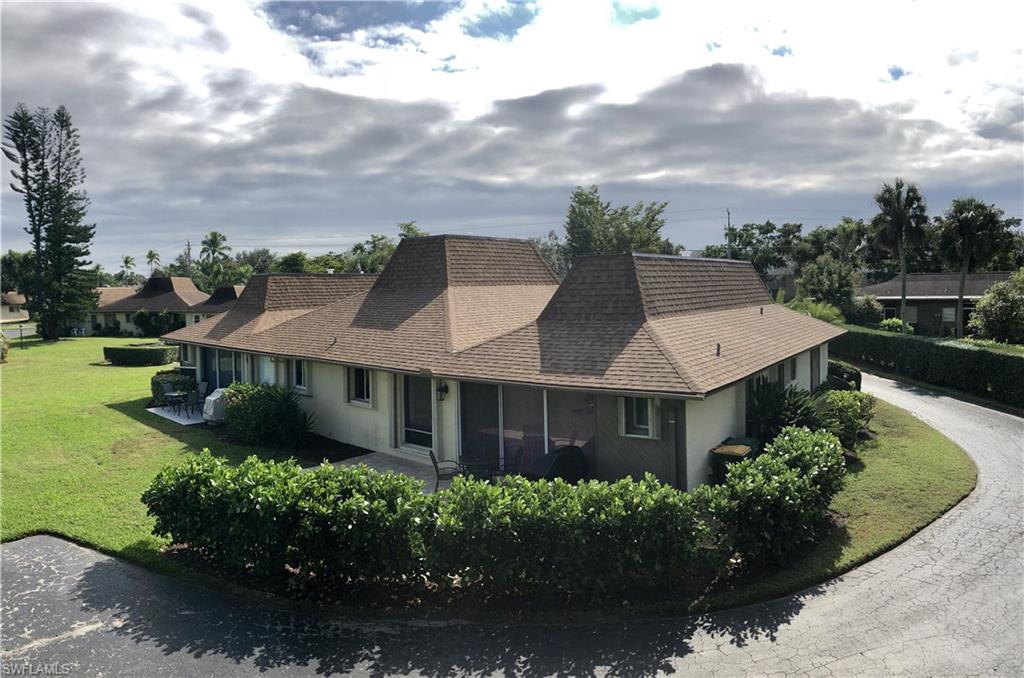 787 Palm View Drive, Unit 3 Naples, FL 34110 - Photo 15 of 19 an aerial view of a house with a yard and potted plants