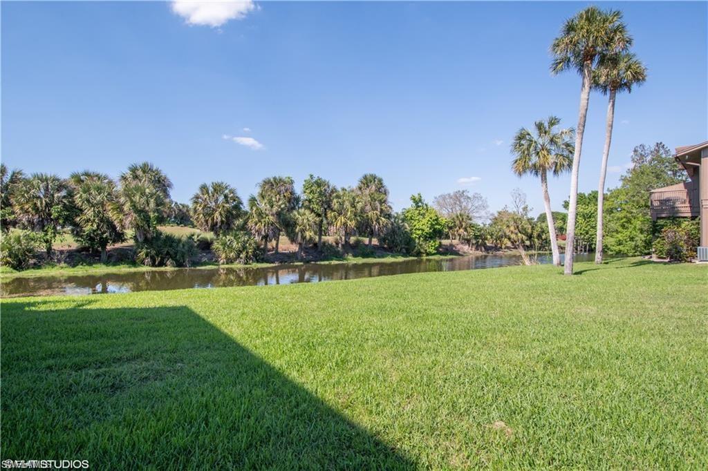 787 Palm View Drive, Unit 3 Naples, FL 34110 - Photo 18 of 19 a view of a golf course with a garden