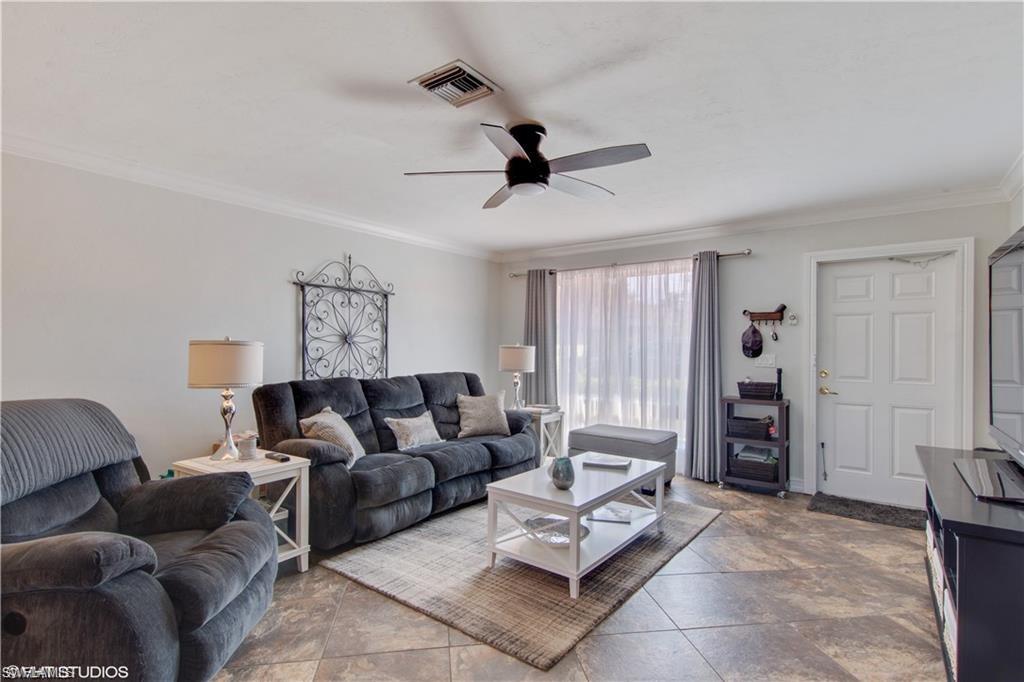 787 Palm View Drive, Unit 3 Naples, FL 34110 - Photo 4 of 19 a living room with furniture and a window