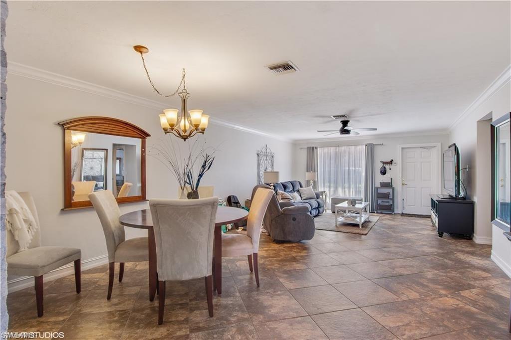 787 Palm View Drive, Unit 3 Naples, FL 34110 - Photo 6 of 19 a view of a dining room with furniture