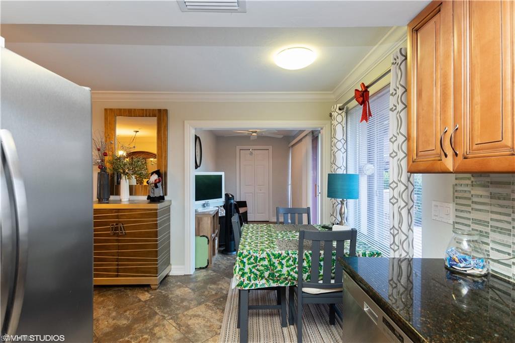 787 Palm View Drive, Unit 3 Naples, FL 34110 - Photo 10 of 19 a view of entryway and kitchen
