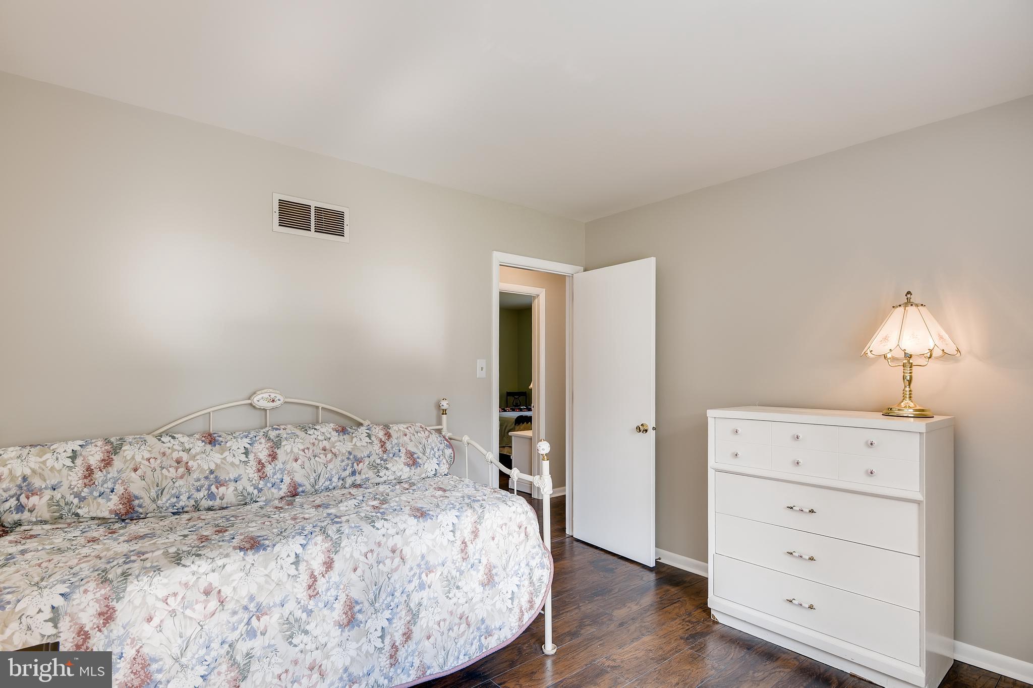 3807 Houcks Road Monkton, MD 21111 - Photo 22 of 32 a bedroom with a bed and a dresser