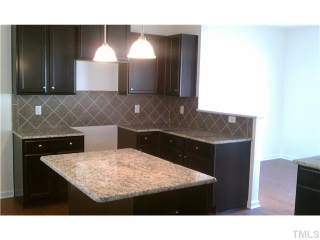 1500 Pattersons Mill Road Durham, NC 27703 - Photo 8 of 25 Beautiful kitchen with granite countertops, stainless appliances to include gas range and tile backsplash! (Appliances will be added)