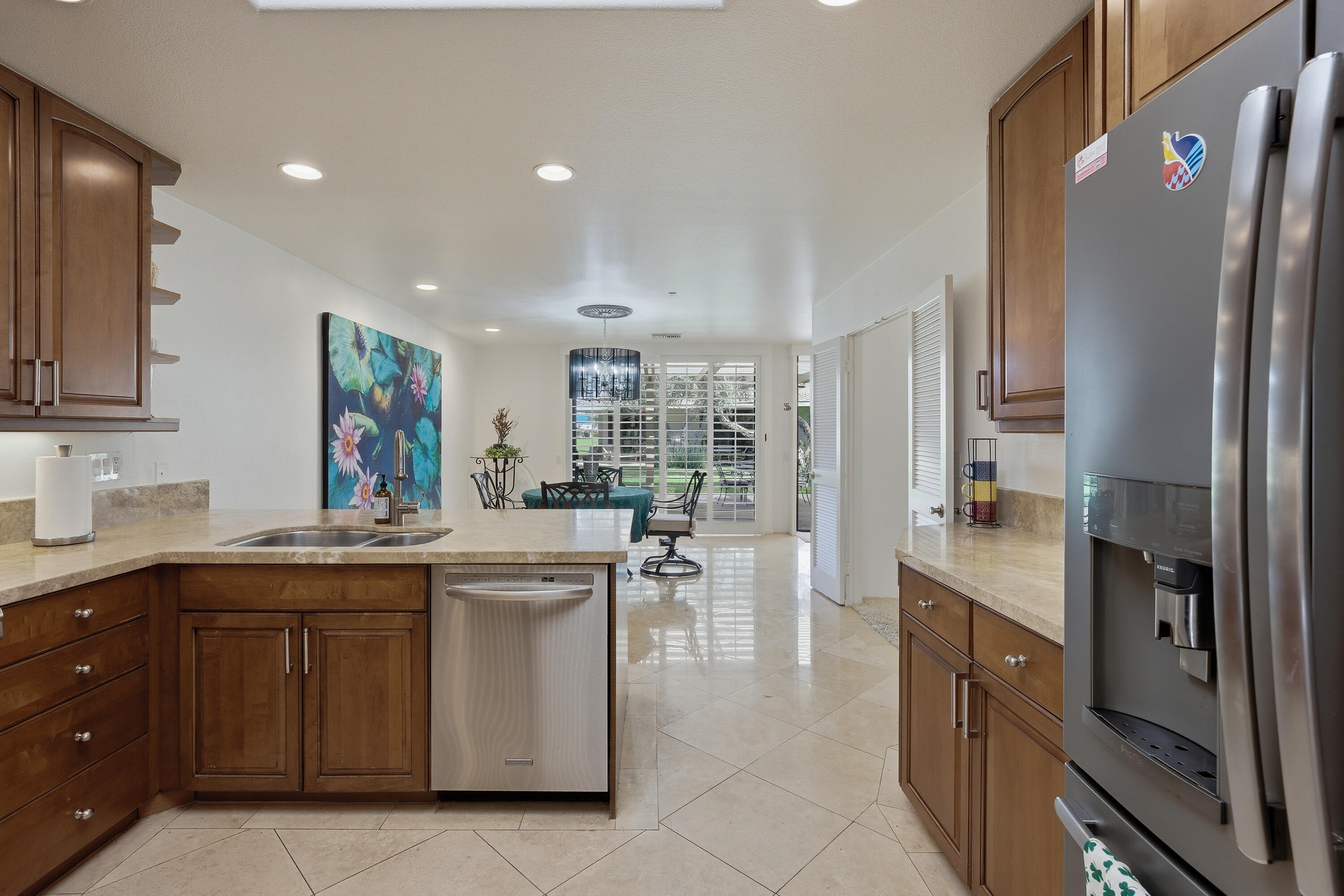 27 Cornell Drive Rancho Mirage, CA 92270 - Photo 12 of 58 a kitchen with a sink stove and cabinets