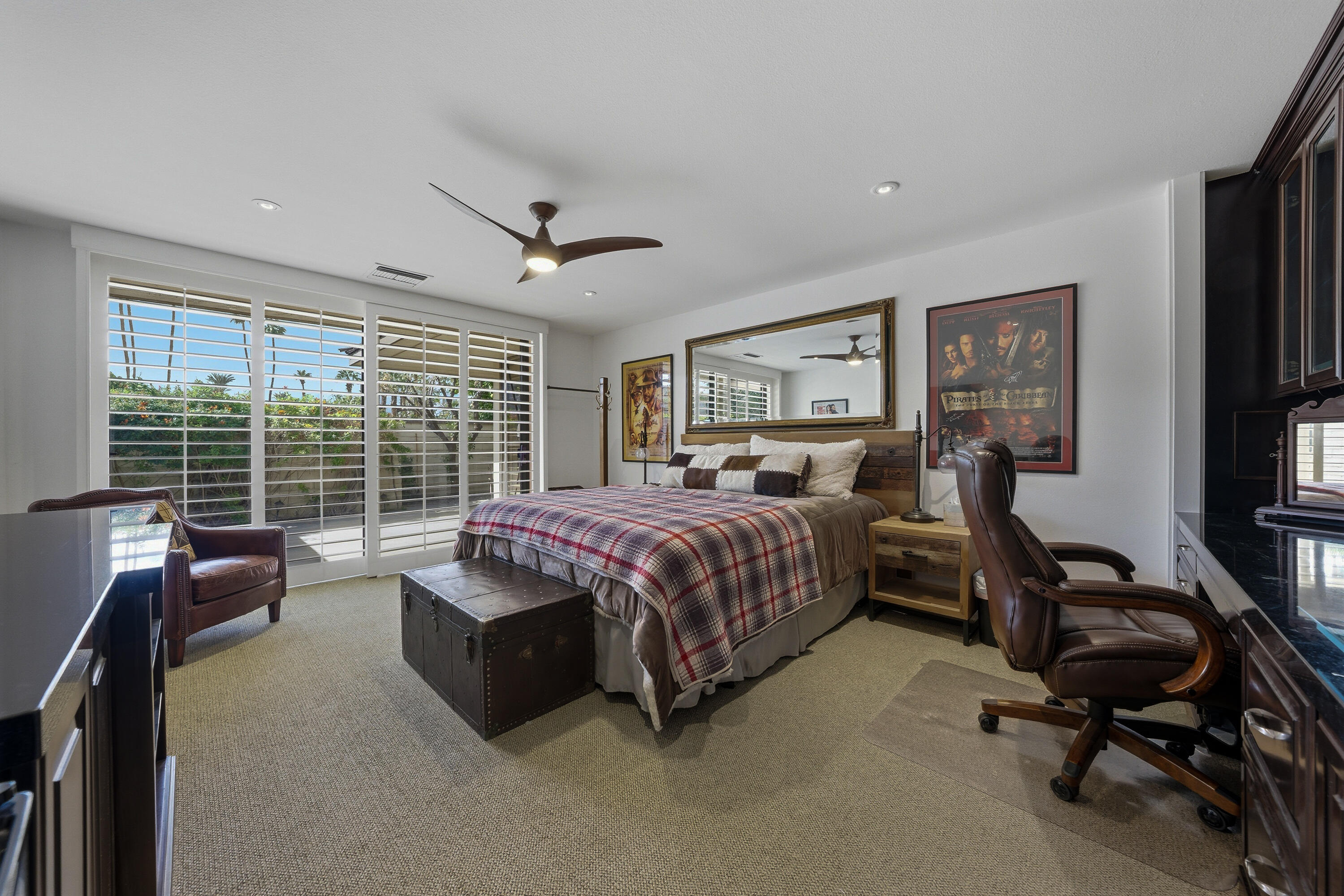 27 Cornell Drive Rancho Mirage, CA 92270 - Photo 13 of 58 a spacious bedroom with a bed a desk and chair