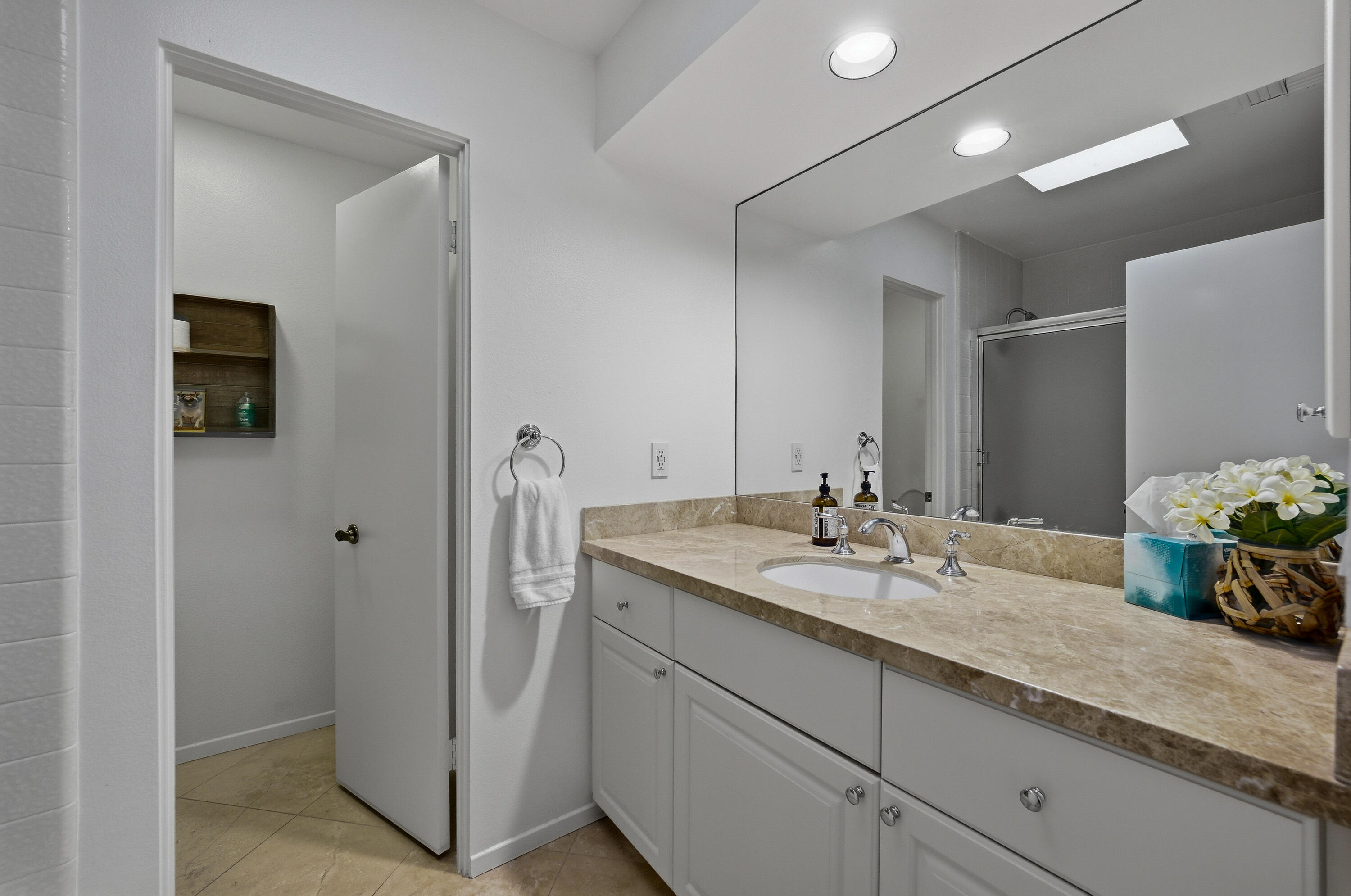 27 Cornell Drive Rancho Mirage, CA 92270 - Photo 14 of 58 a bathroom with a granite countertop double vanity sink and two mirror