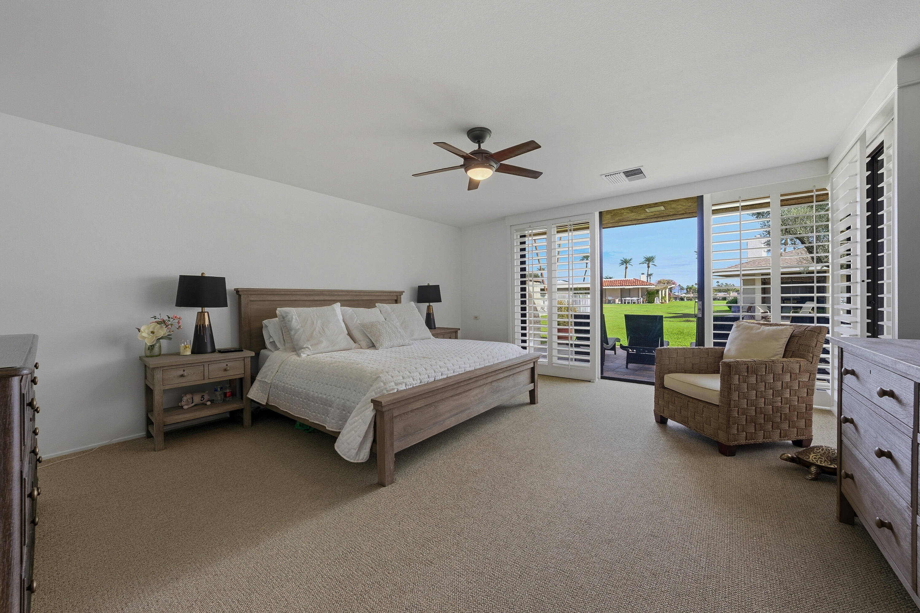 27 Cornell Drive Rancho Mirage, CA 92270 - Photo 15 of 58 a spacious bedroom with a bed couch and a window