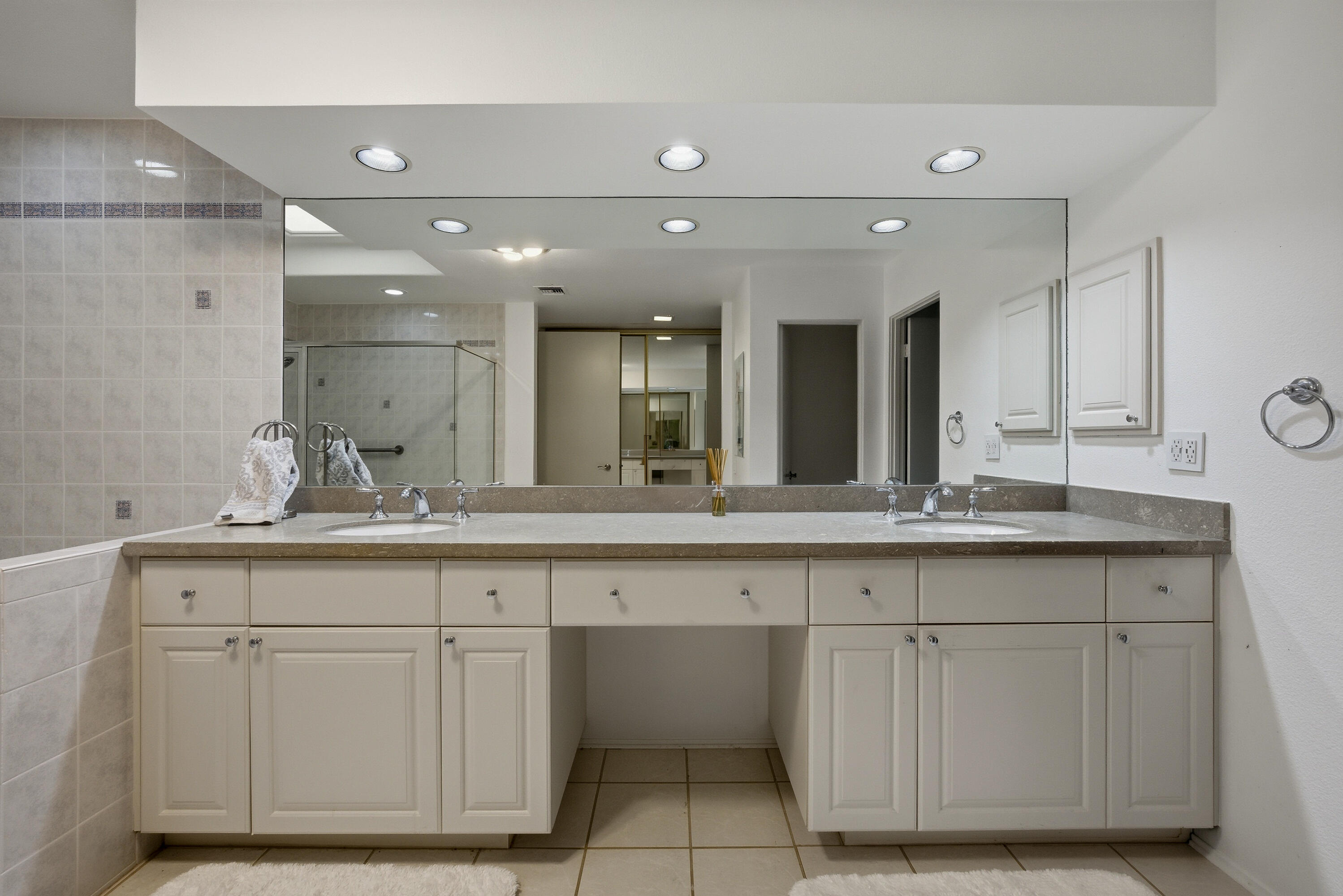 27 Cornell Drive Rancho Mirage, CA 92270 - Photo 16 of 58 a bathroom with a sink and a mirror