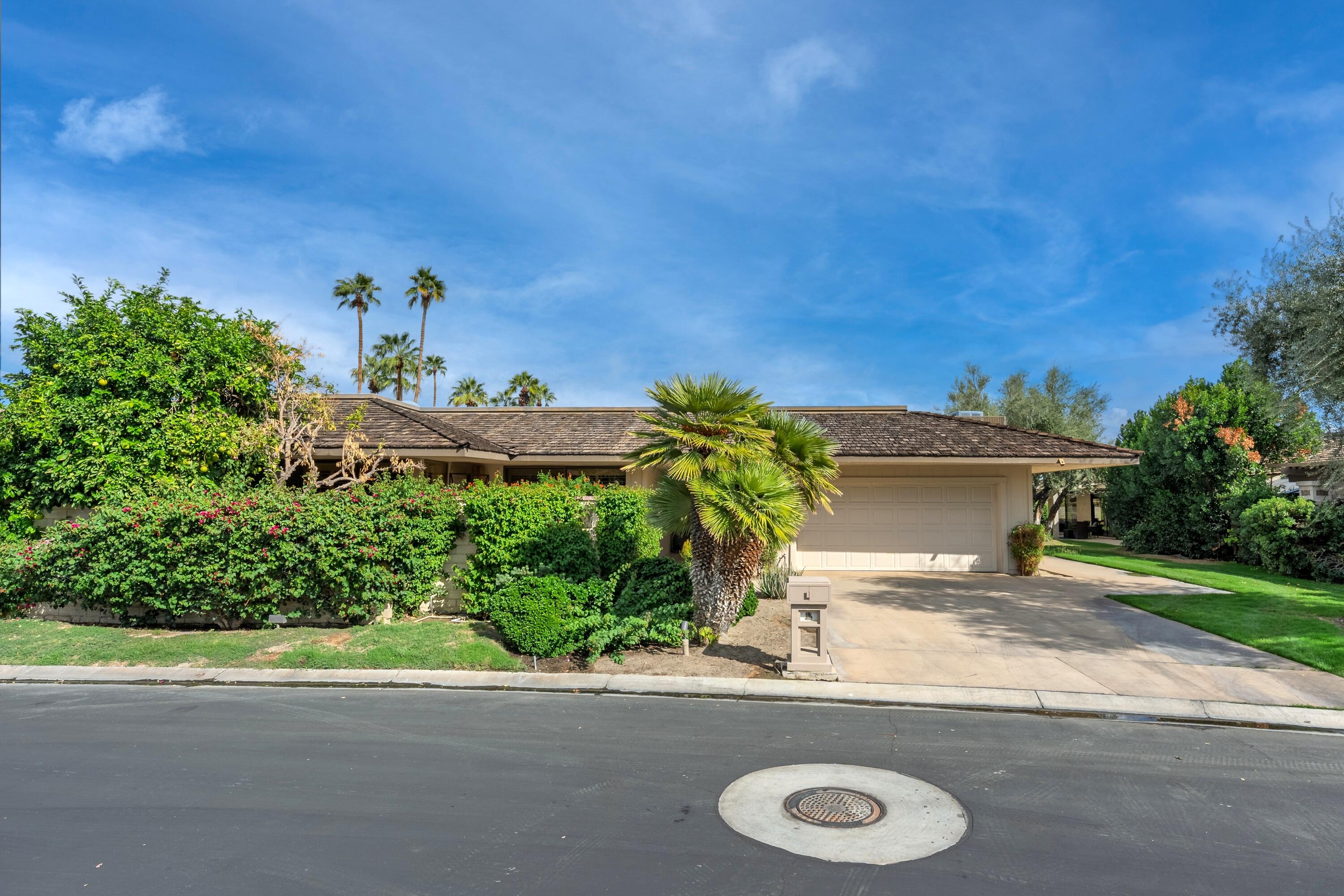 27 Cornell Drive Rancho Mirage, CA 92270 - Photo 23 of 58 a view of a house with a street
