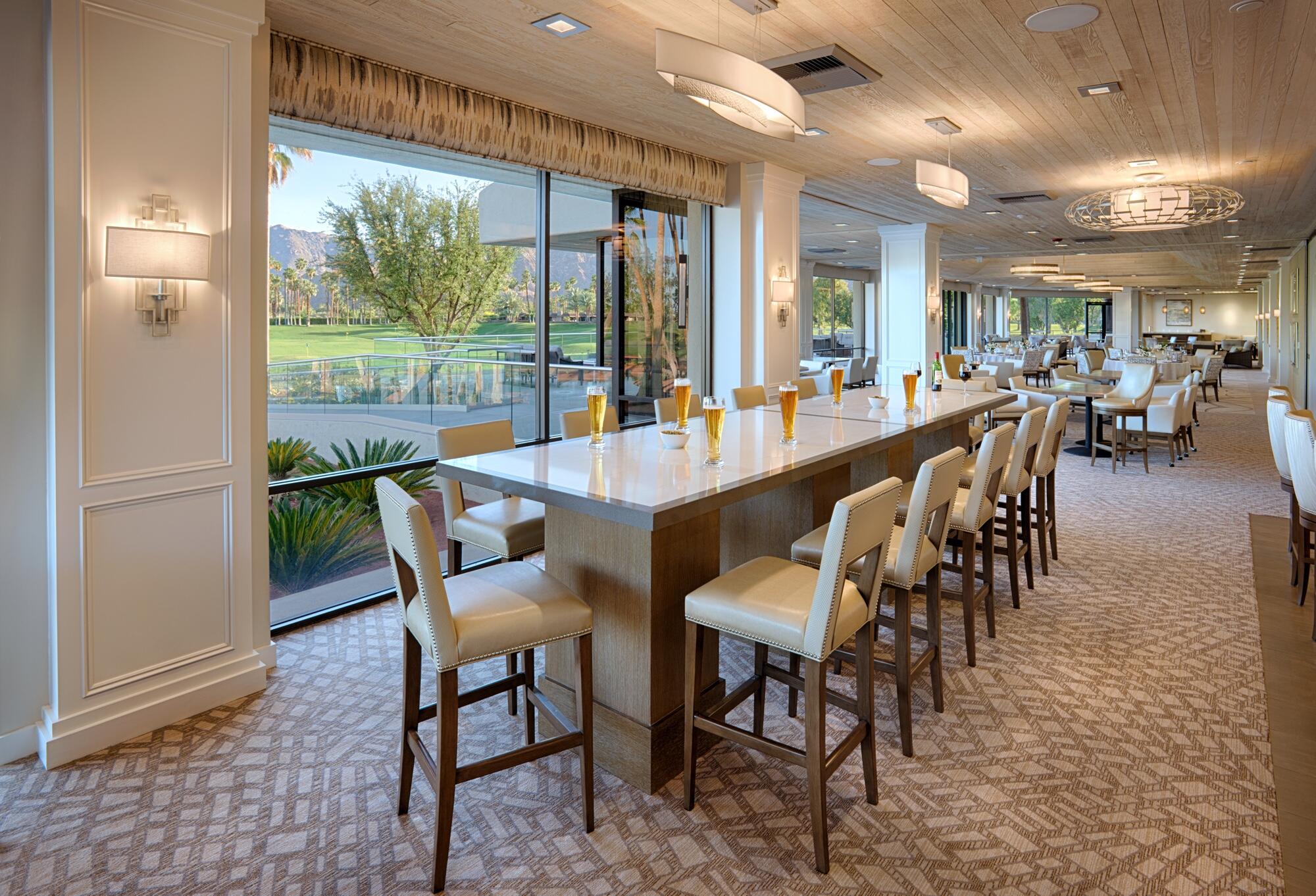 27 Cornell Drive Rancho Mirage, CA 92270 - Photo 54 of 58 a dining room with furniture a chandelier and wooden floor