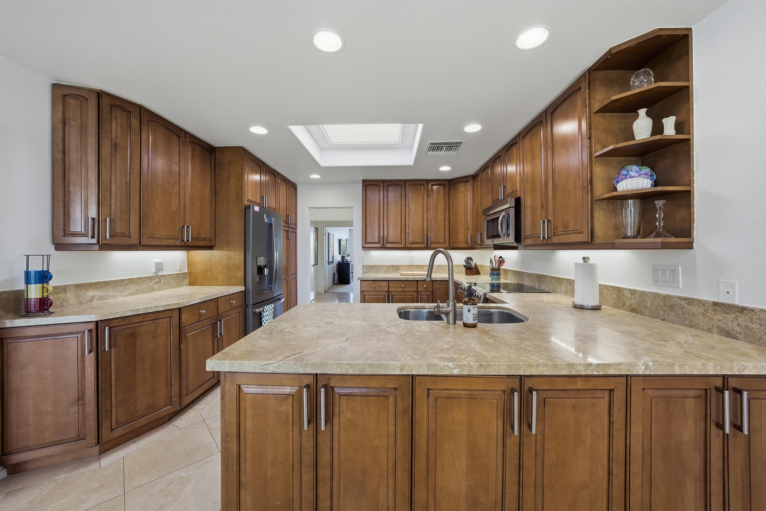 27 Cornell Drive Rancho Mirage, CA 92270 - Photo 10 of 58 a kitchen with a sink a counter space cabinets and appliances