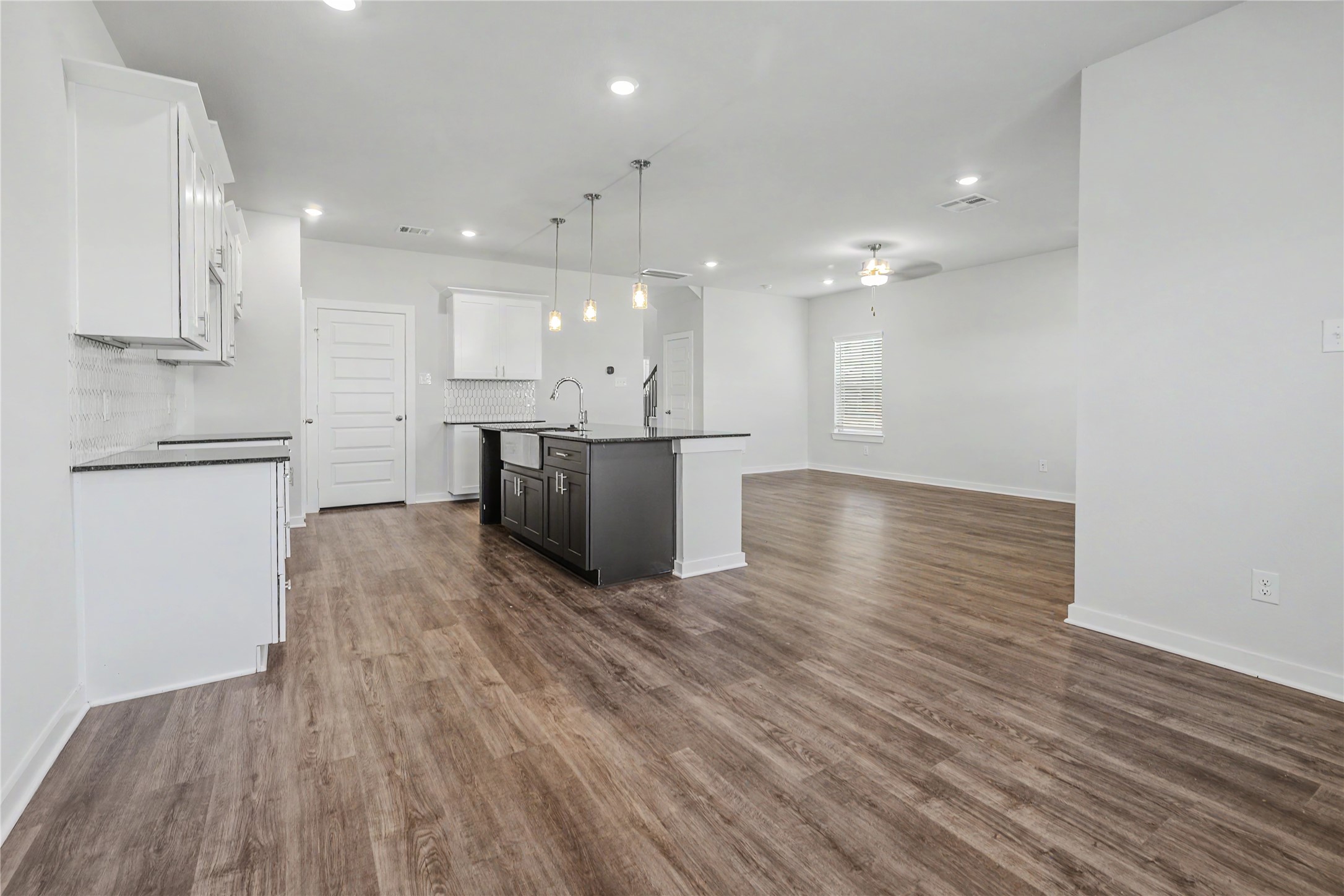 6426 Bolinas Court Rosharon, TX 77583 - Photo 16 of 49 a view of kitchen with stove and wooden floor