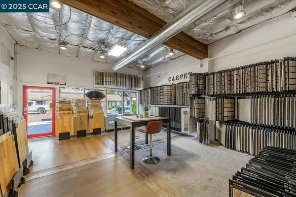 a view of a studio with wooden floor