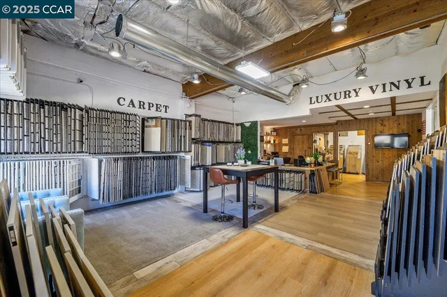 a view of a studio with wooden floor