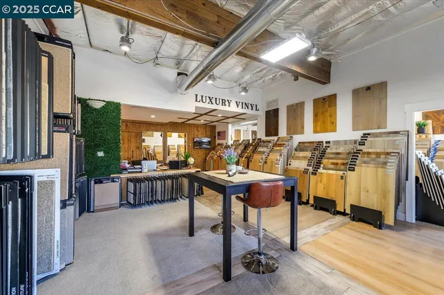 a view of a chairs and tables in a patio