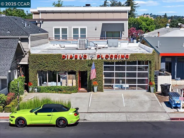 a front view of a house with a garden and parking