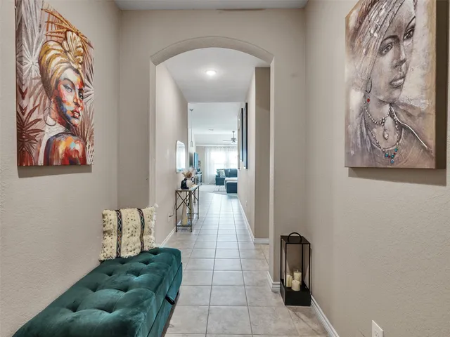a living room with furniture and a rug