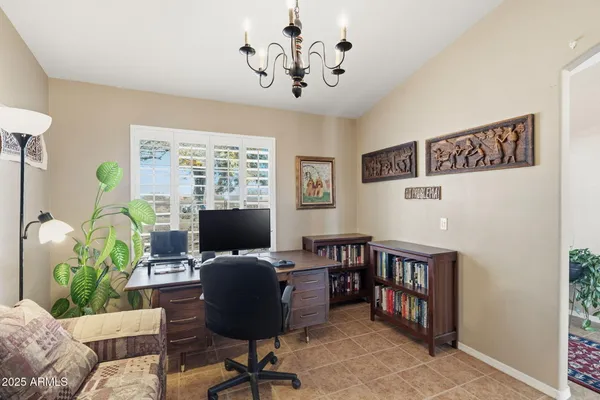 a front view of house with yard and ocean view