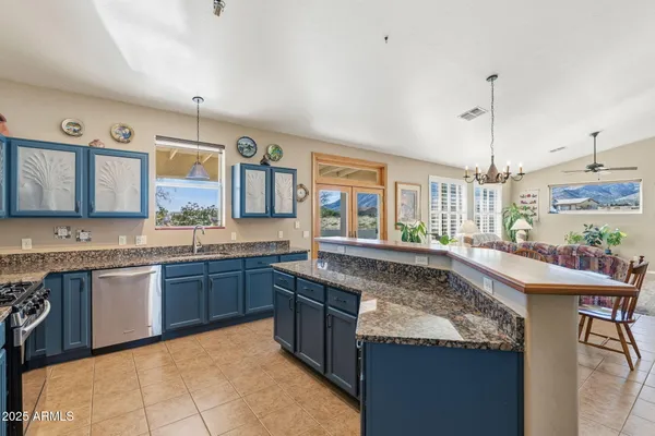 a large kitchen with a stove and cabinets