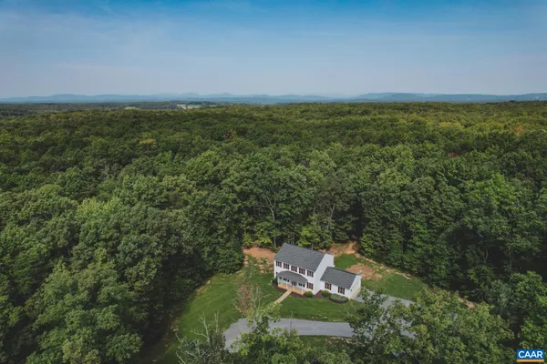 an aerial view of residential house with outdoor space