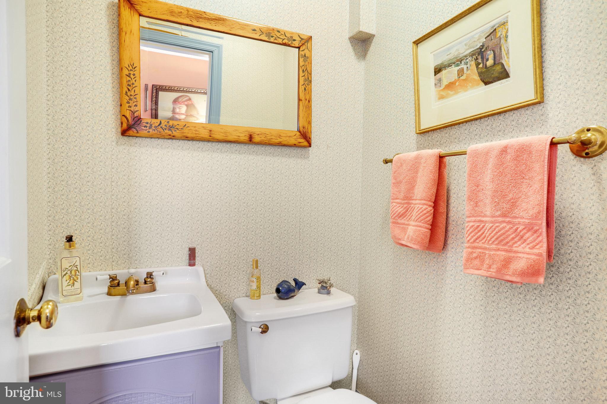 4920 43rd Place Northwest Washington, DC 20016 - Photo 11 of 25 a bathroom with a sink mirror and toilet