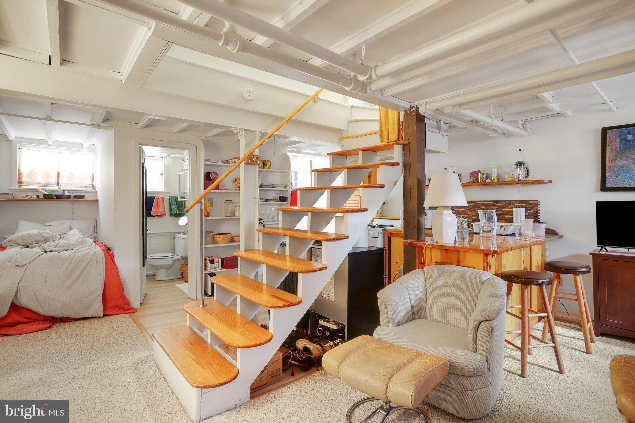 4920 43rd Place Northwest Washington, DC 20016 - Photo 13 of 25 a living room with furniture a rug and a chandelier