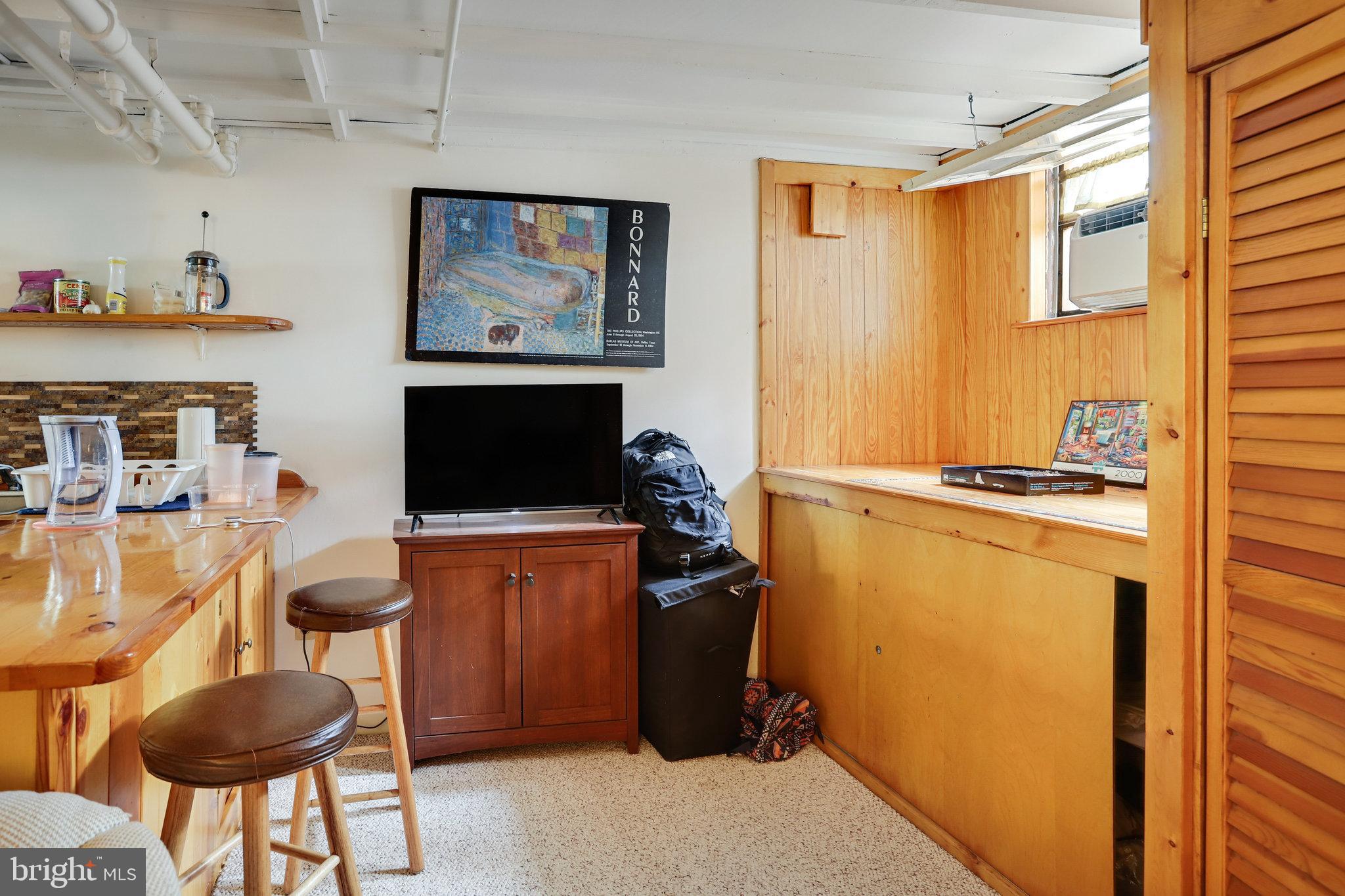 4920 43rd Place Northwest Washington, DC 20016 - Photo 14 of 25 a bedroom with furniture and a window