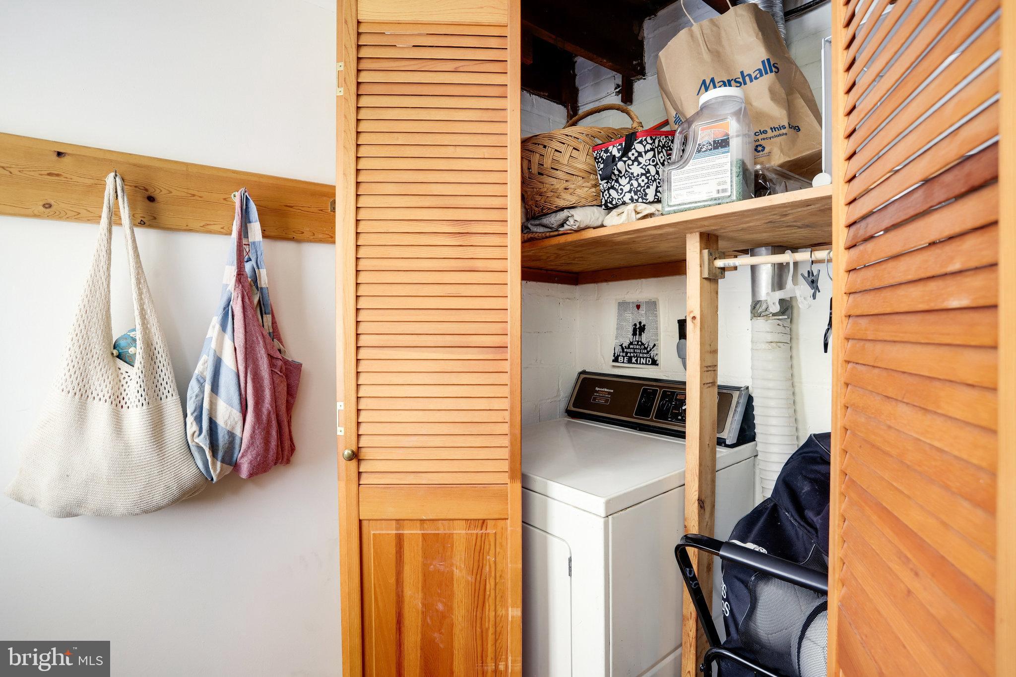 4920 43rd Place Northwest Washington, DC 20016 - Photo 16 of 25 a view of walk in closet with clothes and shoes