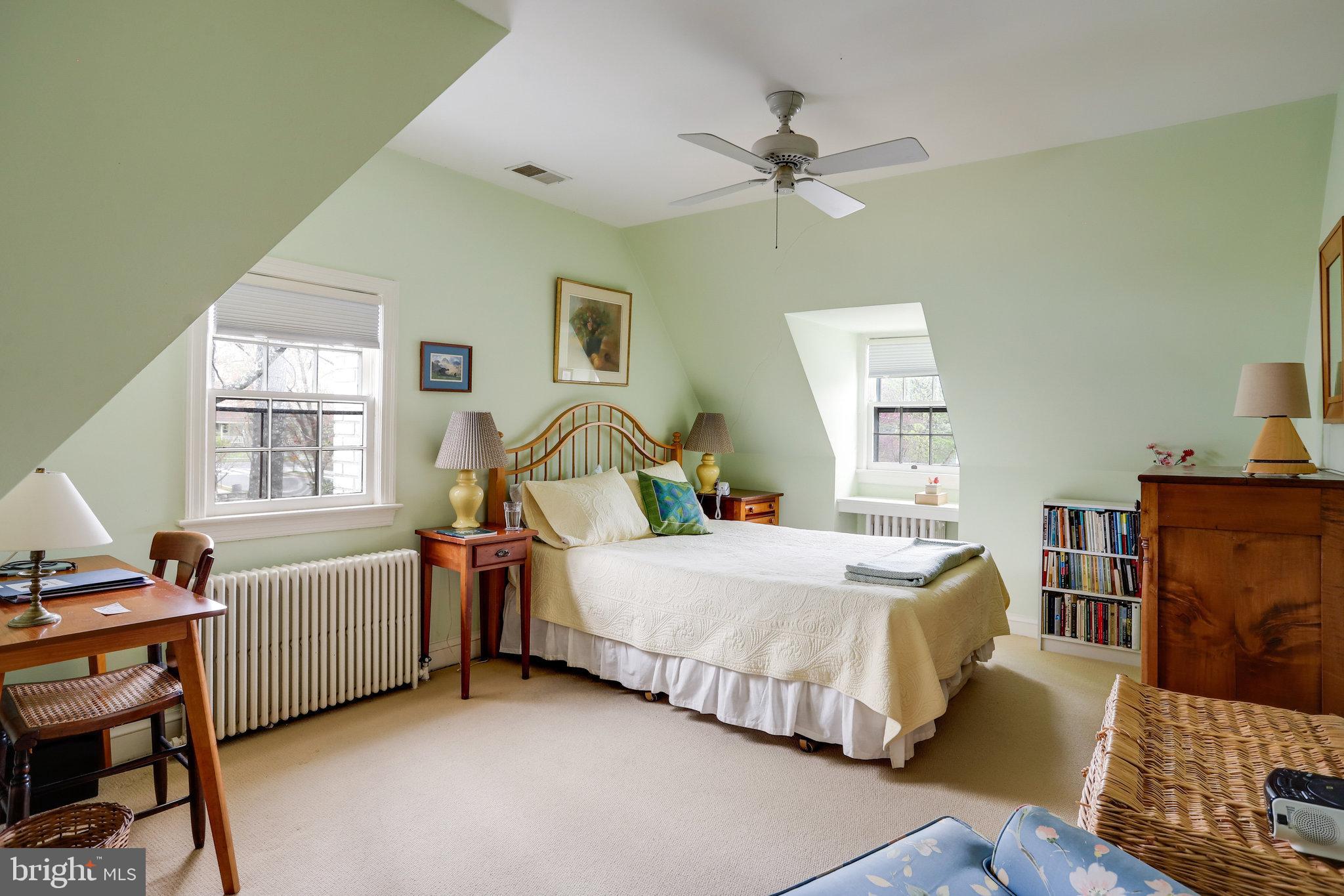 4920 43rd Place Northwest Washington, DC 20016 - Photo 17 of 25 a bedroom with a bed and a window