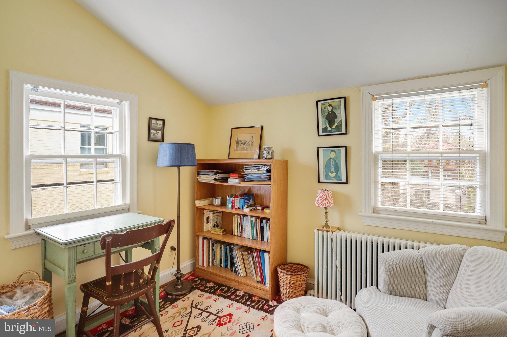 4920 43rd Place Northwest Washington, DC 20016 - Photo 18 of 25 a bedroom with furniture and a window