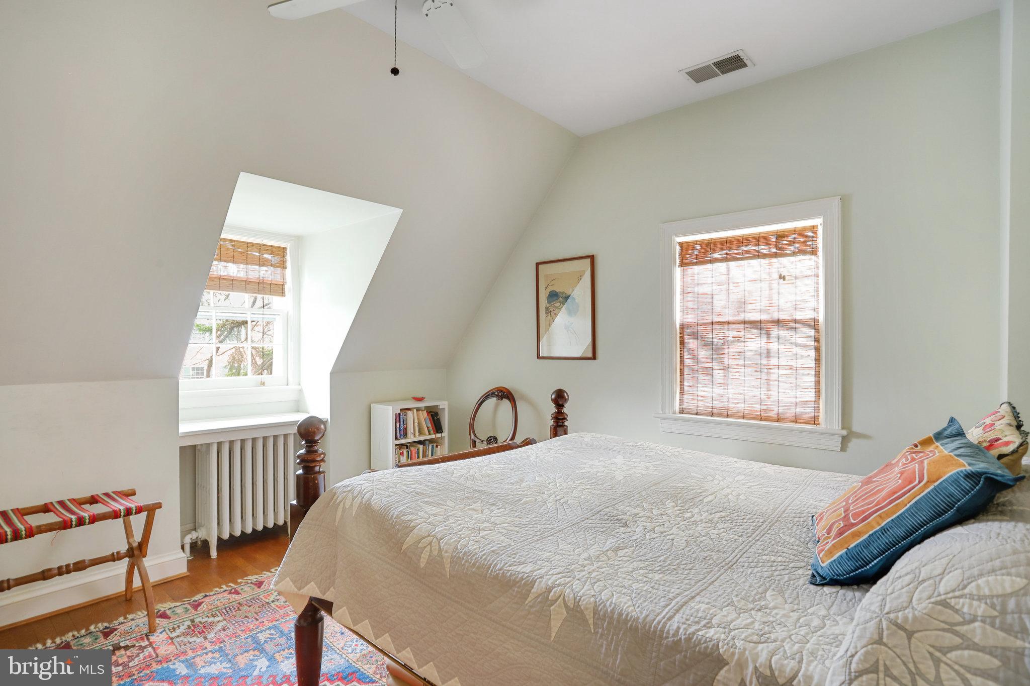 4920 43rd Place Northwest Washington, DC 20016 - Photo 20 of 25 a bedroom with a bed and a window