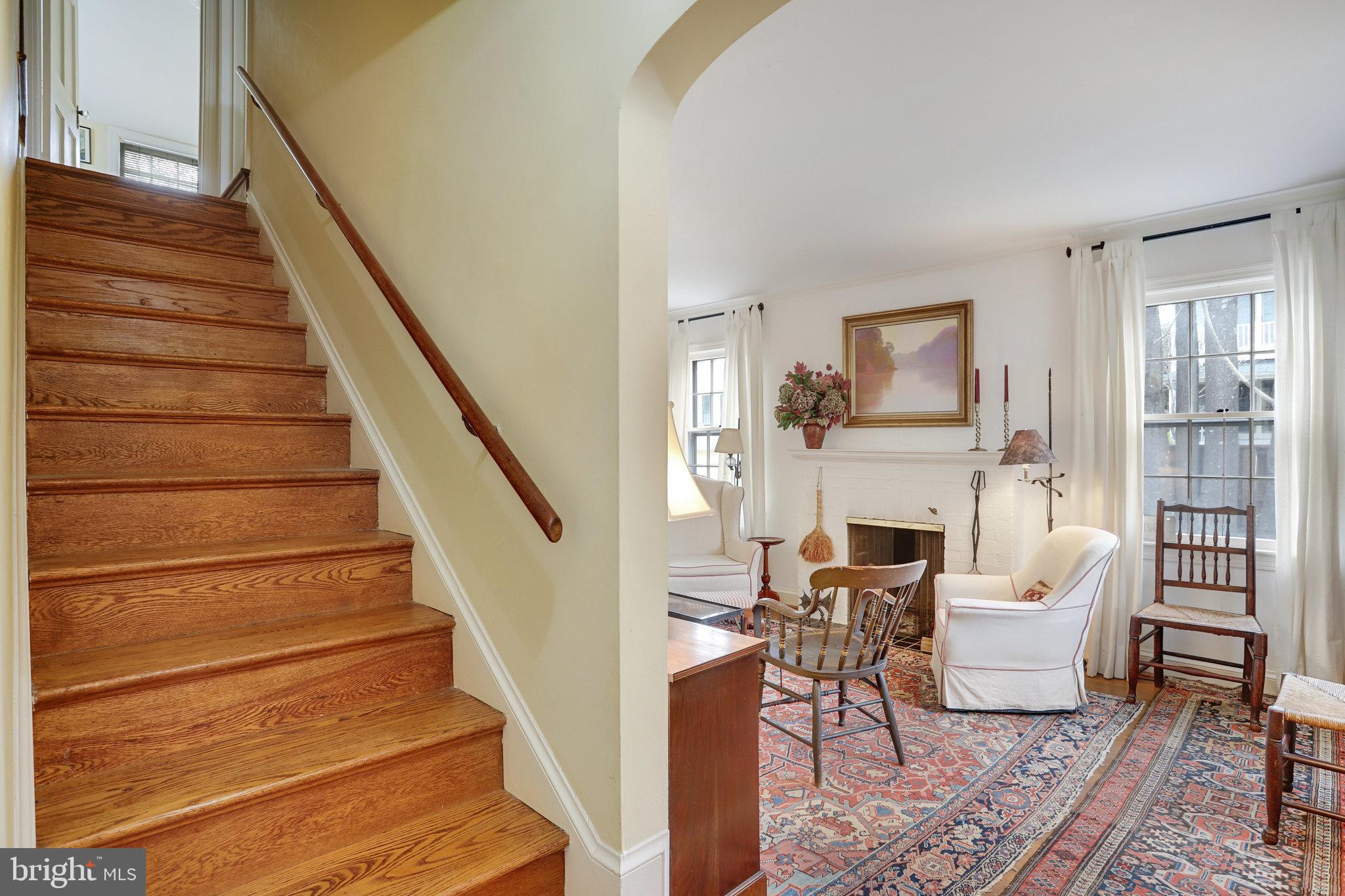 4920 43rd Place Northwest Washington, DC 20016 - Photo 3 of 25 a living room with furniture and a fireplace