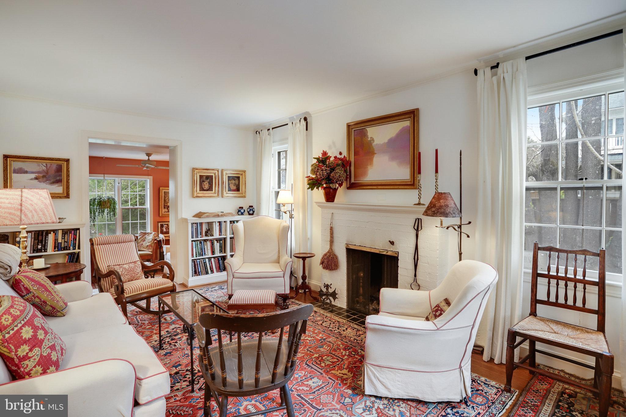 4920 43rd Place Northwest Washington, DC 20016 - Photo 5 of 25 a living room with furniture a fireplace and a large window